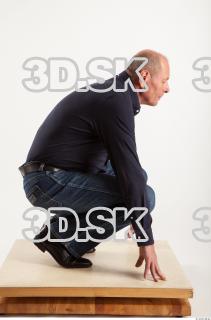 Kneeling pose blue deep shirt jeans of Ed 0007